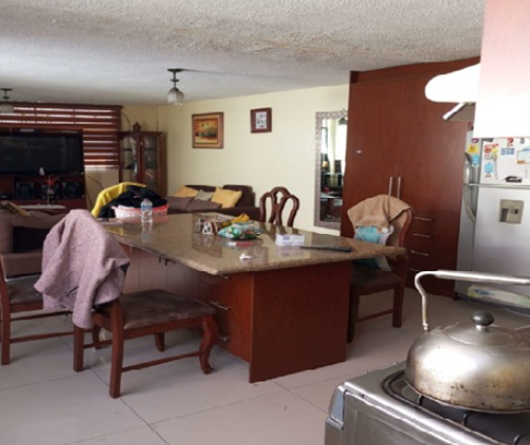 EC-RJ-157453 — Cocina y comedor Cocina con mesón y área de comedor de la casa